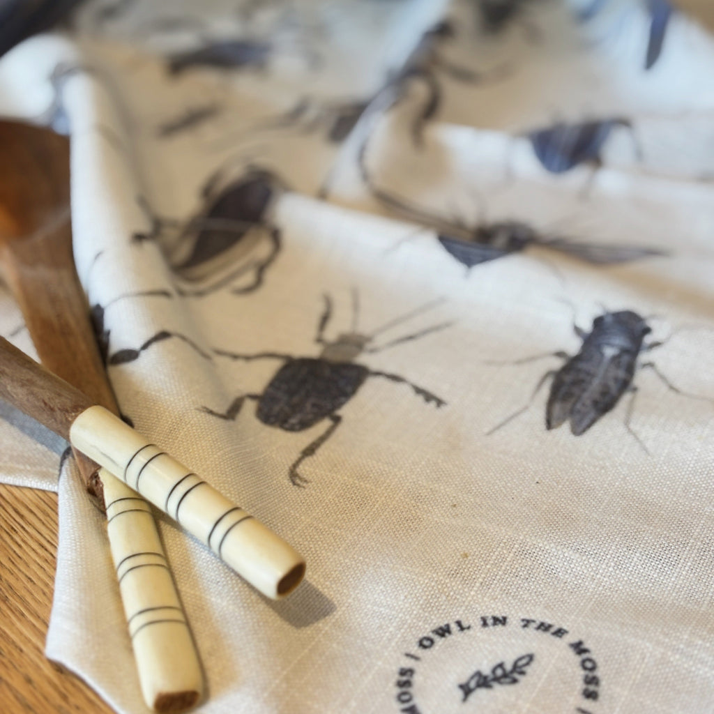 Ink bugs linen tea towel