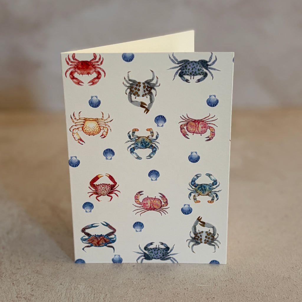 Five small gift cards with colorful undersea-themed illustrations, including crabs, seahorses, and sea plants, arranged on a textured beige surface. Printed on textured ivory paper. 