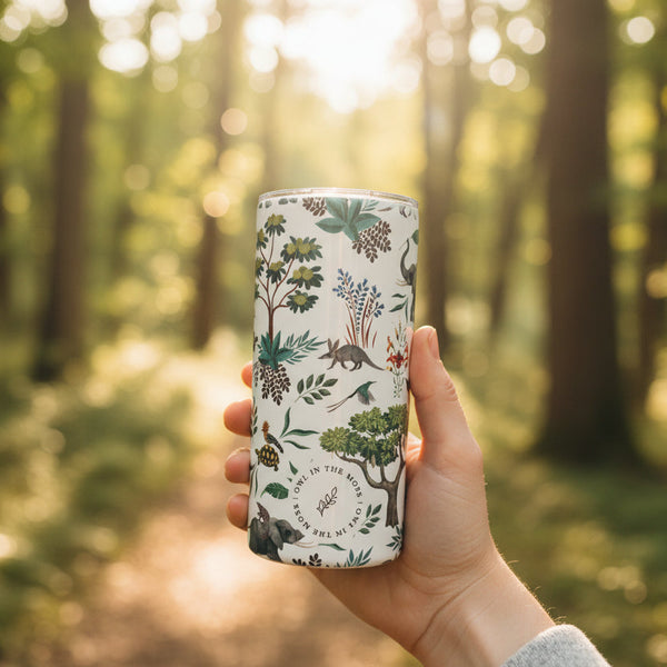 Tumbler with nature-themed design on a neutral background