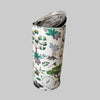 Tumbler with nature-themed design on a plain surface