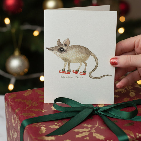 Set of Christmas-themed greeting cards with illustrations on a textured surface